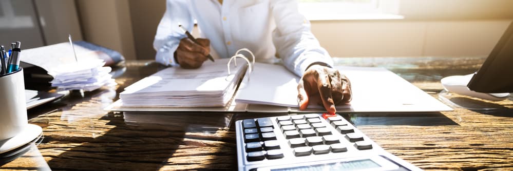 man budgeting for heavy equipment purchase
