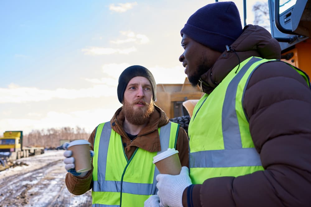 construction workers in cold weather drinking coffee