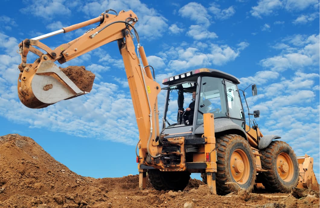 inspecting used backhoe loader for sale