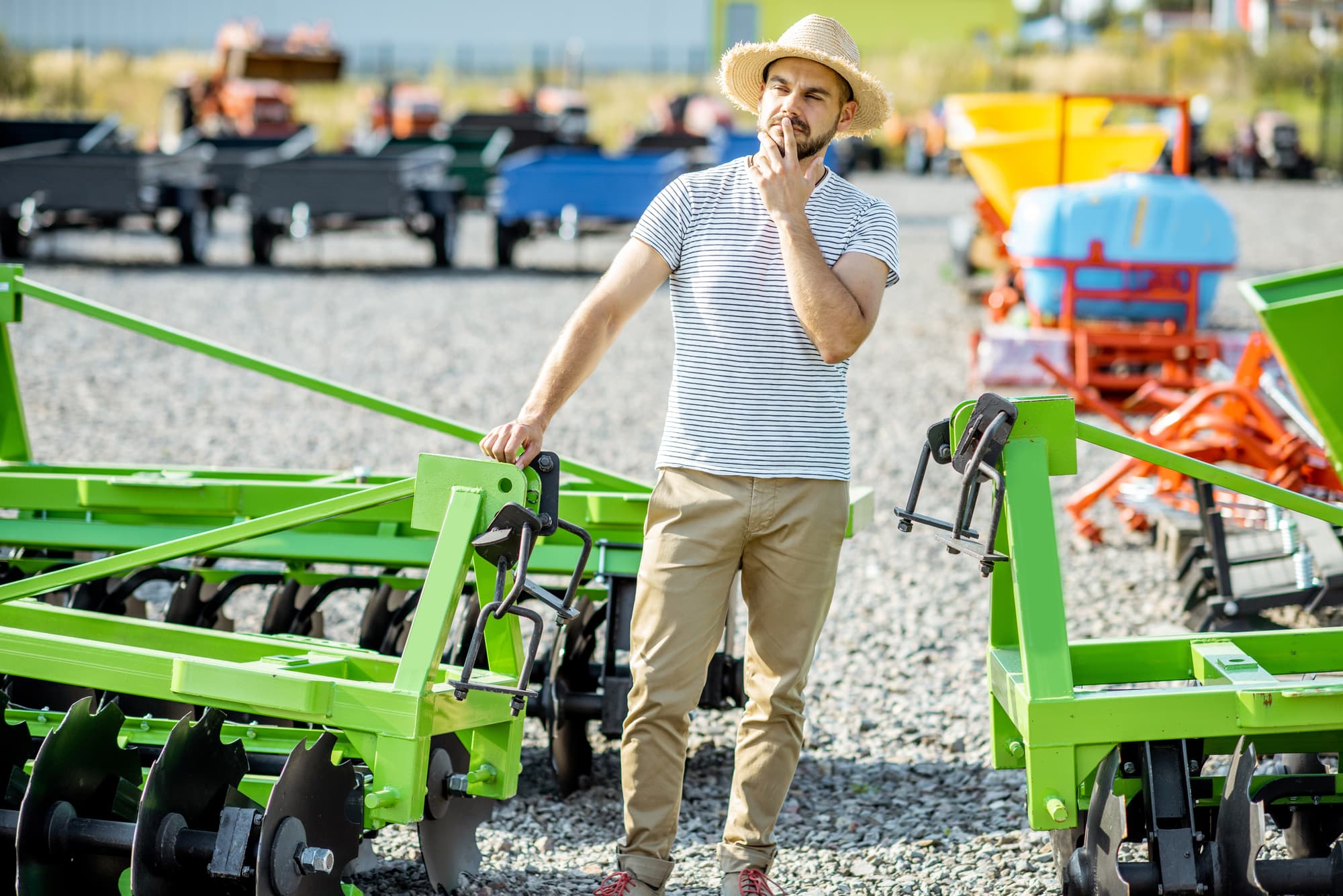 man considering purchases at heavy equipment auction