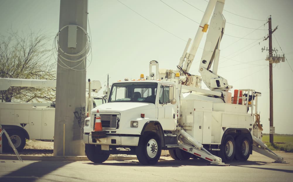 boom truck with extended outrigger stabilizers