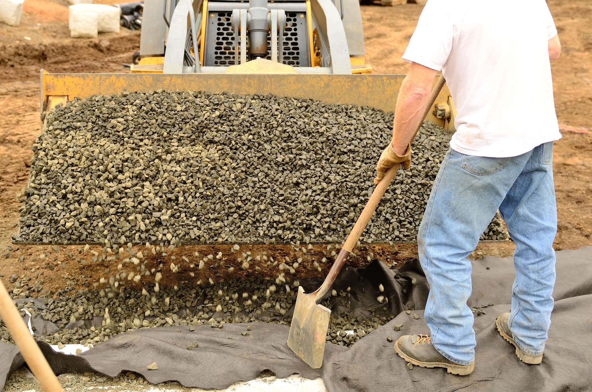 front loader gravel for French drain installation