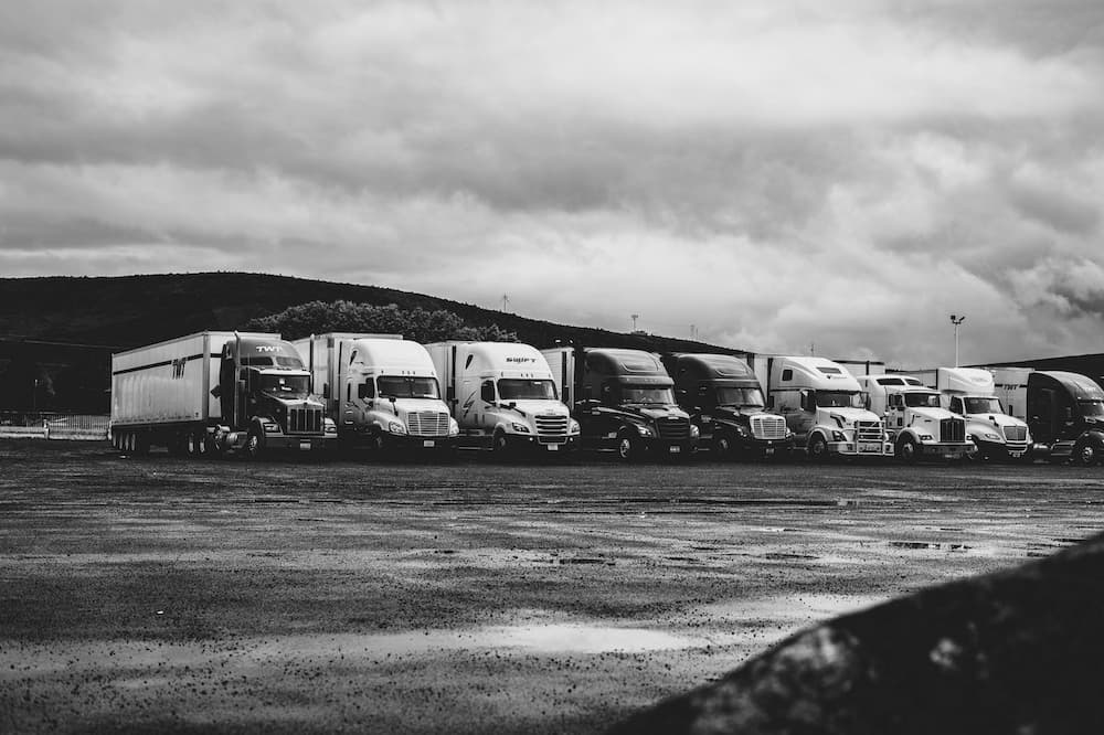 Semi Trucks Under Clouds by Kevin Bidwell