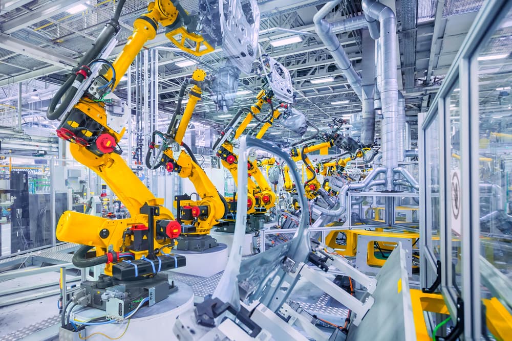 heavy equipment manufacturing automation robotic arms on assembly line