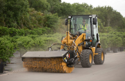 Cat 903D with cleaning attachment