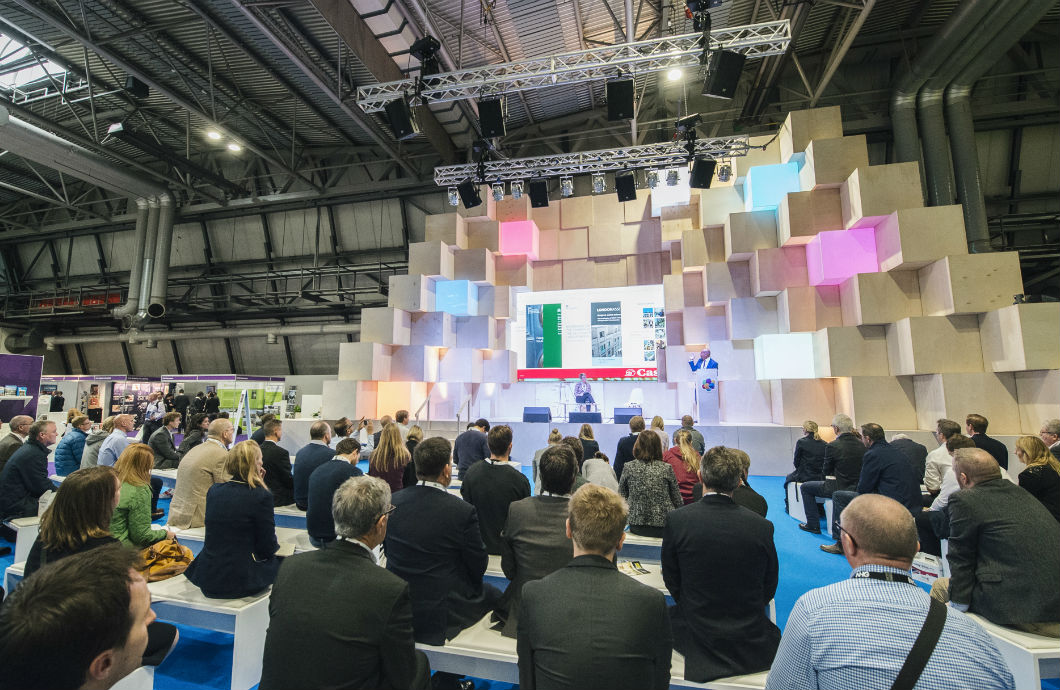 Crowd watching a presentation on the UKCW stage